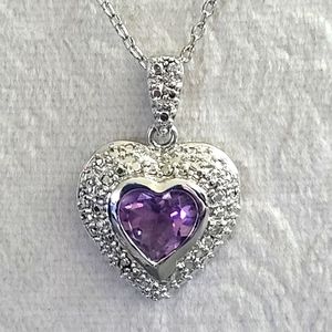 S.Silver 925 ladies necklace with amethyst center stone surrounded by diamonds.